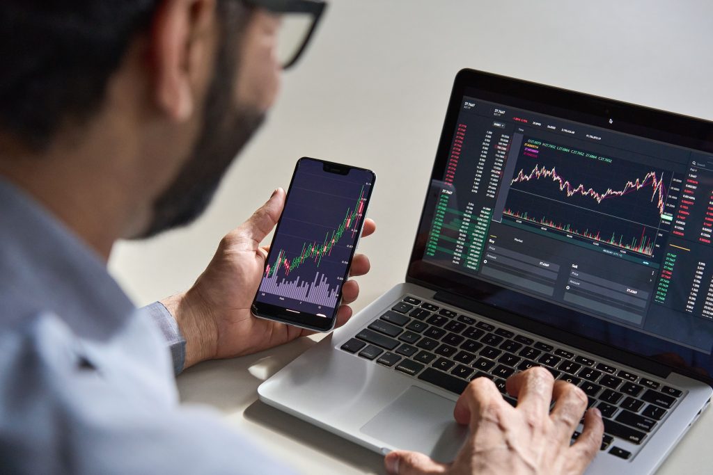 business person investing in shares